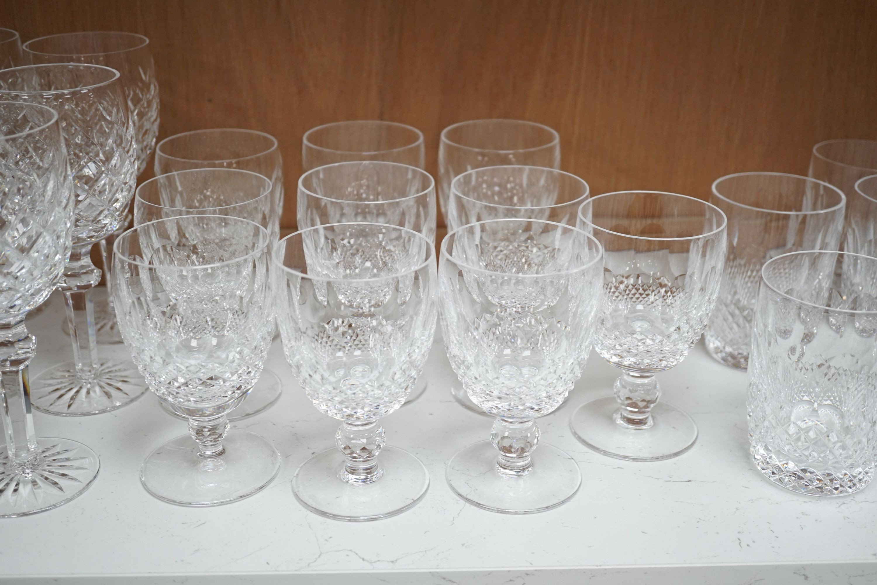 A set of eighteen Waterford cut crystal low goblets and tumblers and twelve further Waterford cut crystal wine glasses in a different pattern